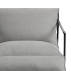 Fauteuil d'appoint en tissu, avec structure en métal et assise suspendue.