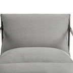 Fauteuil d'appoint en tissu, avec structure en métal et assise suspendue.